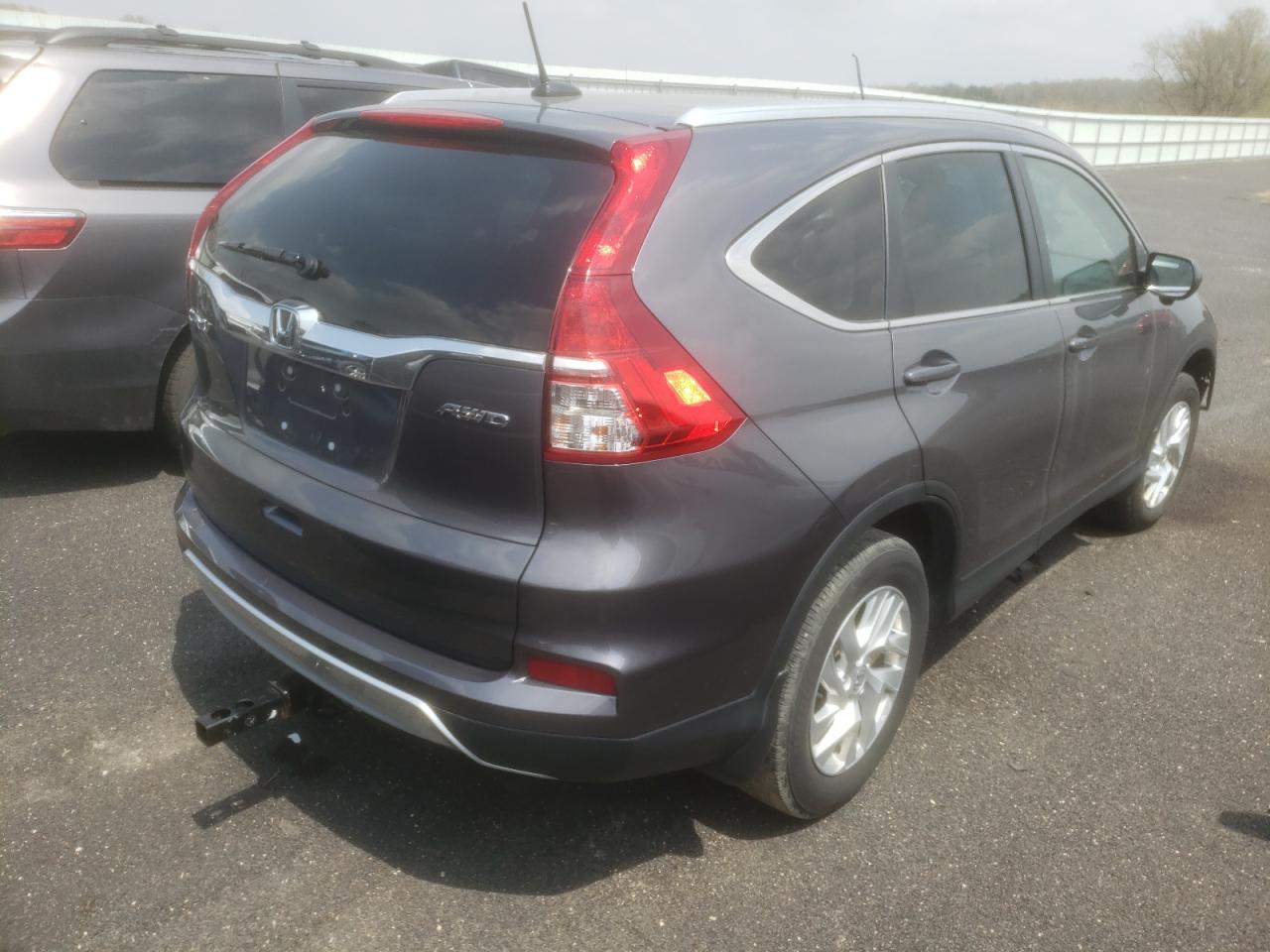 Photo 4 from auction – 2015 HONDA CR-V EXL with VIN 5J6RM4H74FL040572