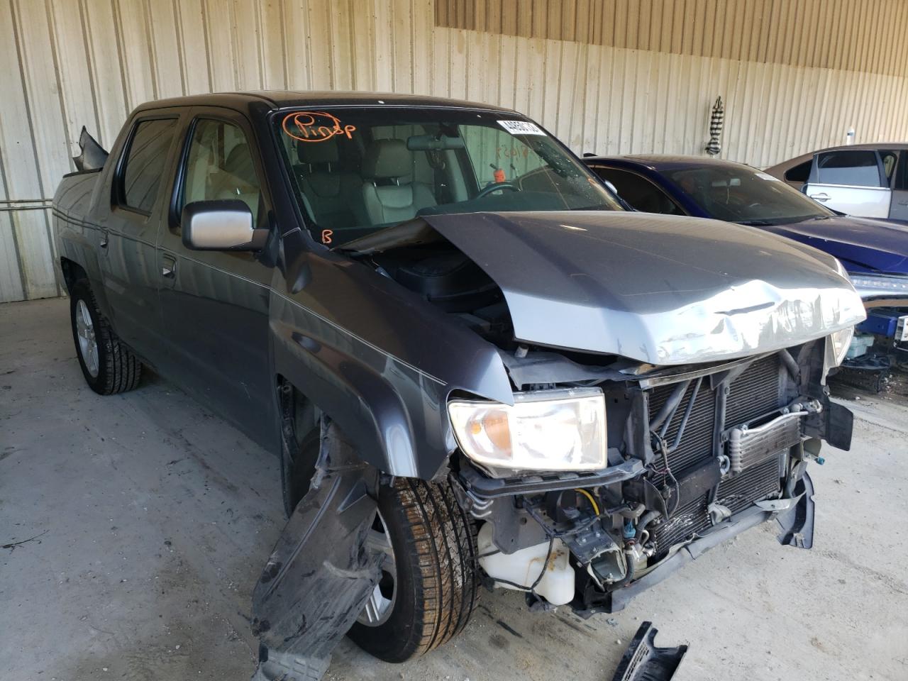 HONDA RIDGELINE 2011 with VIN 5FPYK1F55BB001050 - Photo from auction