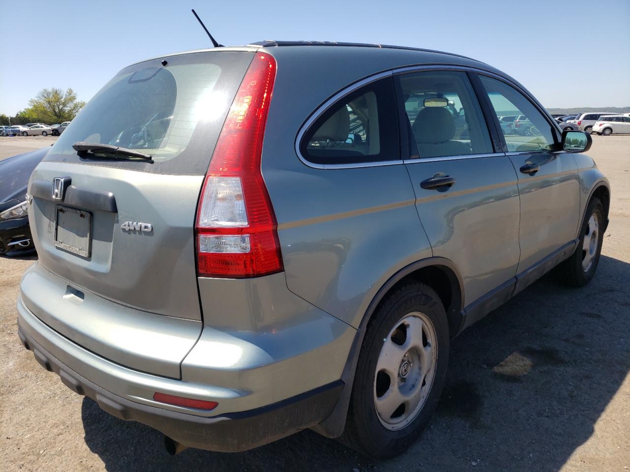 Photo 4 from auction – 2011 HONDA CR-V with VIN 5J6RE4H37BL062649