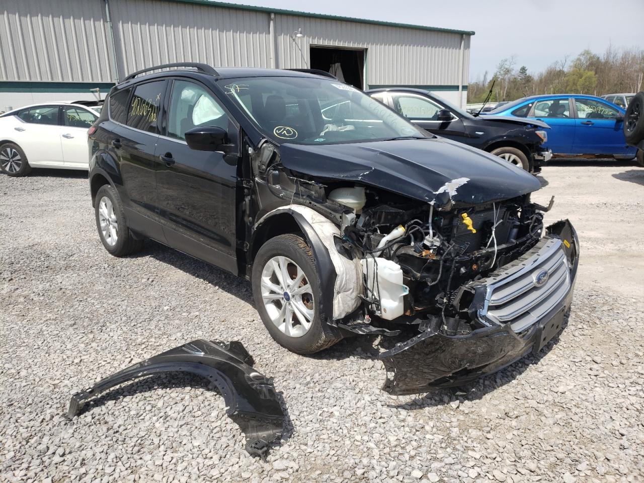 FORD ESCAPE SE 2018 with VIN 1FMCU9GD3JUC29860 - Photo from auction