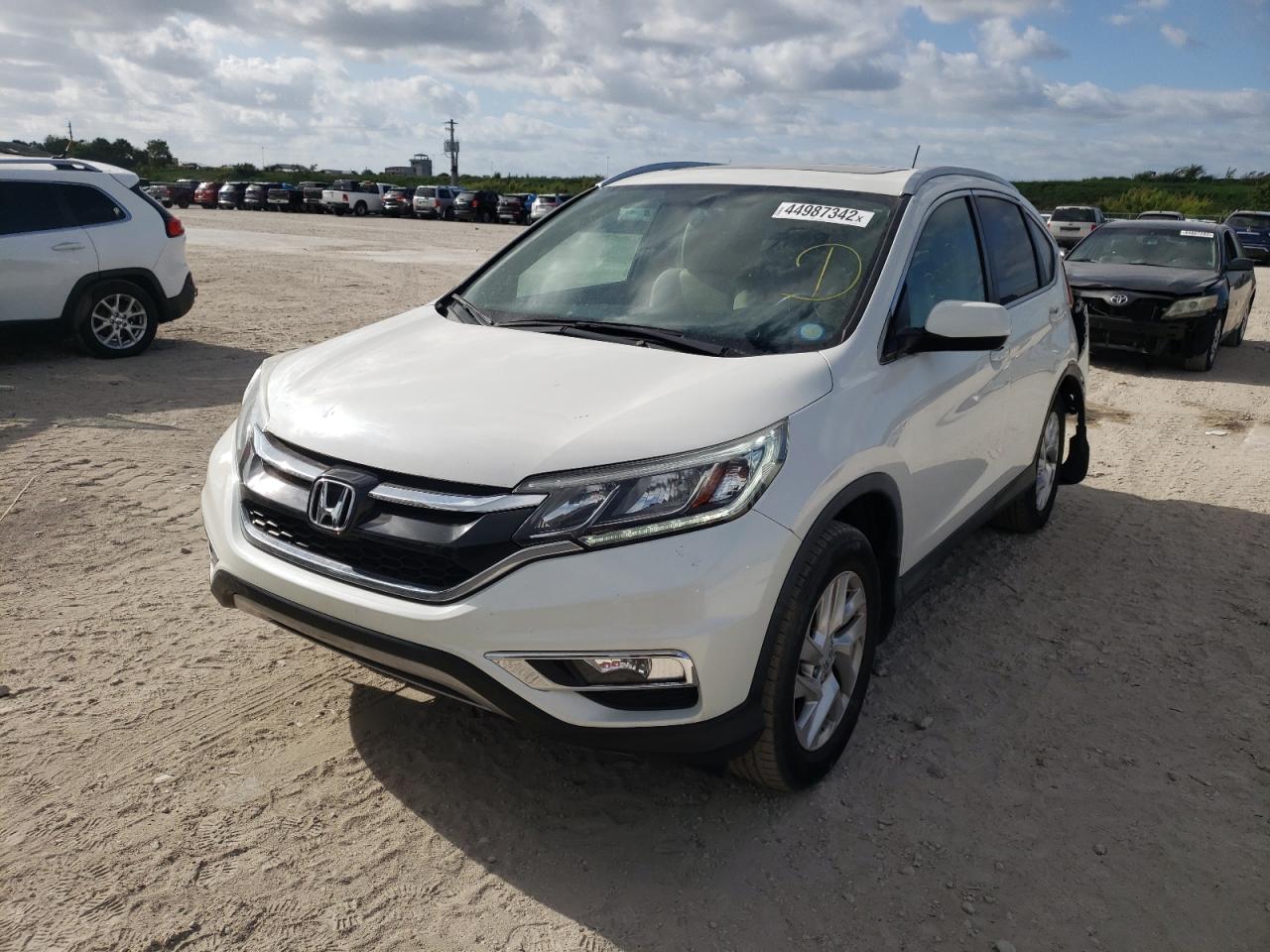 Photo 2 from auction – 2016 HONDA CR-V EXL with VIN 5J6RM3H75GL017779