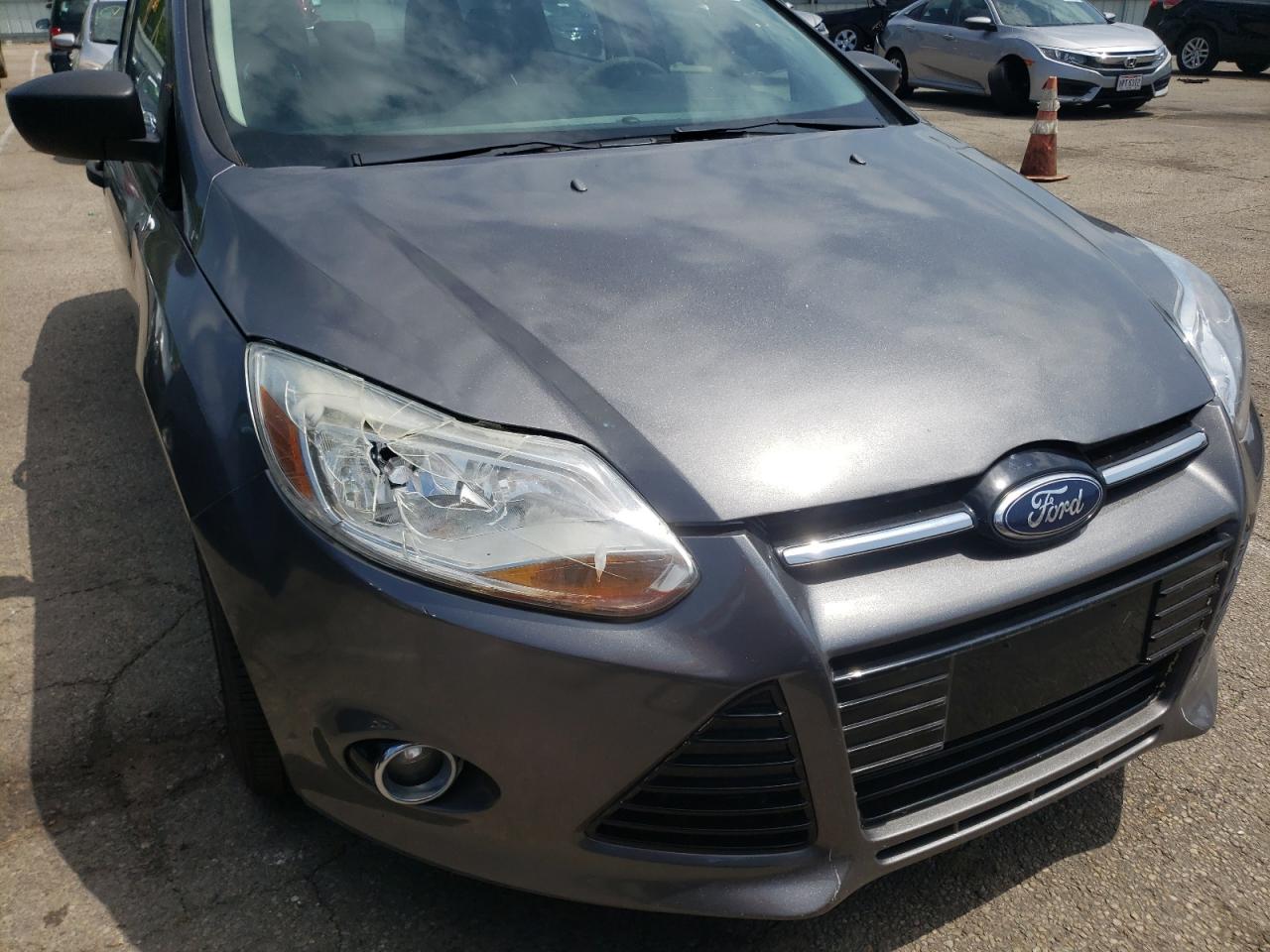 Photo 9 from auction – 2014 FORD FOCUS S with VIN 1FADP3E20EL380235