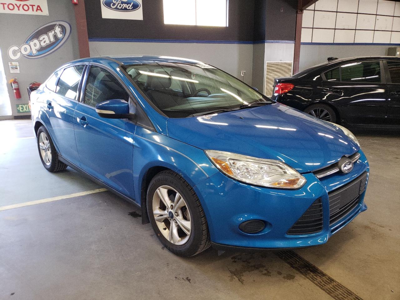 FORD FOCUS SE 2013 with VIN 1FADP3F21DL299645 - Photo from auction
