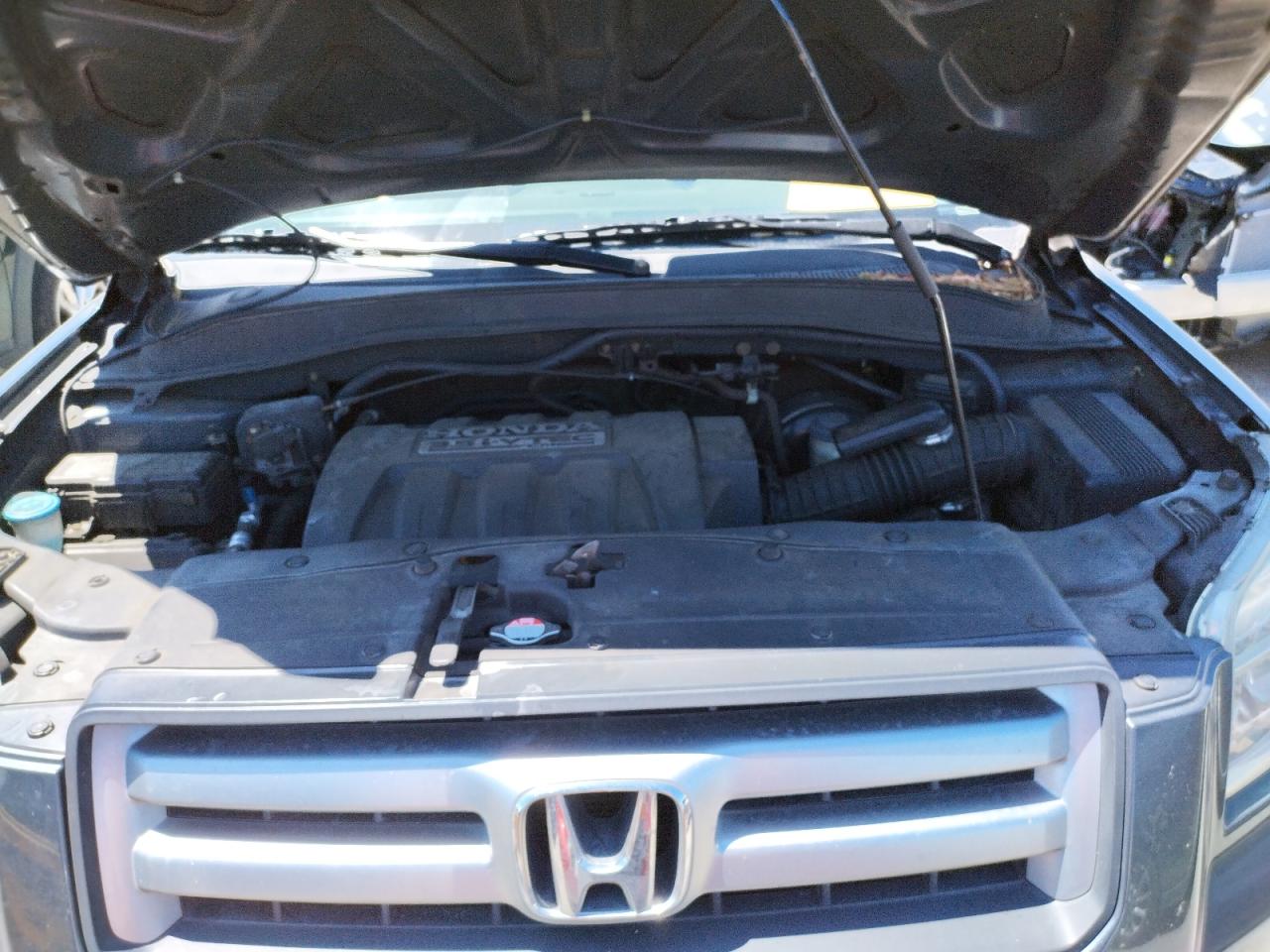 Photo 7 from auction – 2006 HONDA PILOT LX with VIN 5FNYF28126B012381