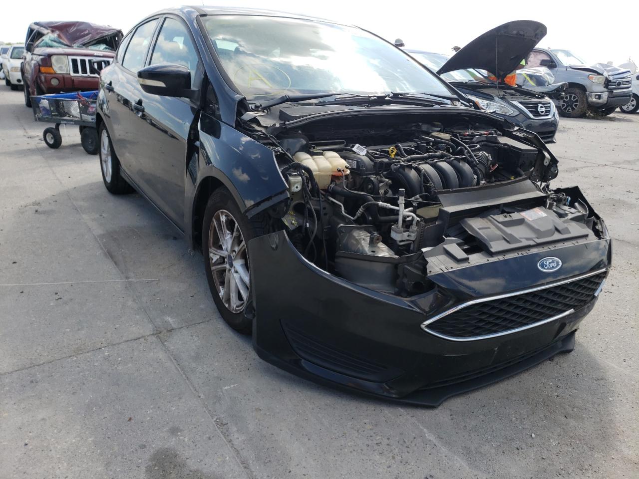 FORD FOCUS SE 2015 with VIN 1FADP3K25FL282145 - Photo from auction