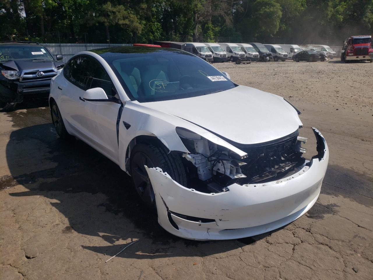 TESLA MODEL 3 2021 with VIN 5YJ3E1EAXMF086687 - Photo from auction
