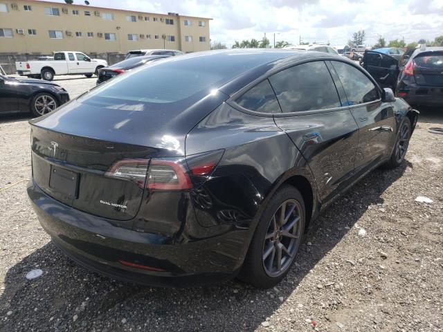 Photo 4 from auction – 2021 TESLA MODEL 3 with VIN 5YJ3E1EB6MF924528