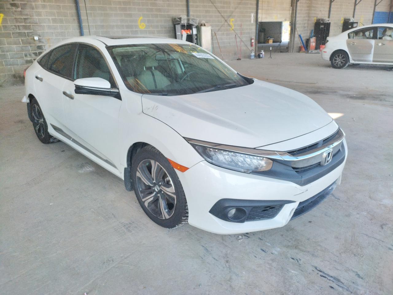 HONDA CIVIC TOUR 2017 with VIN 19XFC1F92HE005149 - Photo from auction