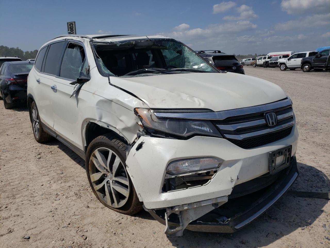 HONDA PILOT TOUR 2017 with VIN 5FNYF5H93HB018006 - Photo from auction