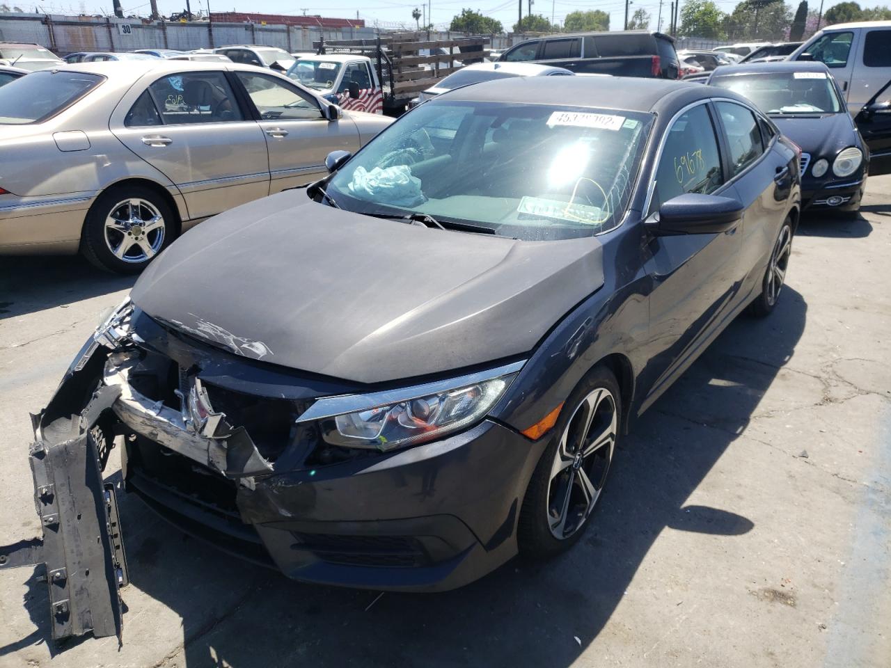 Photo 2 from auction – 2016 HONDA CIVIC LX with VIN 19XFC2F59GE011337