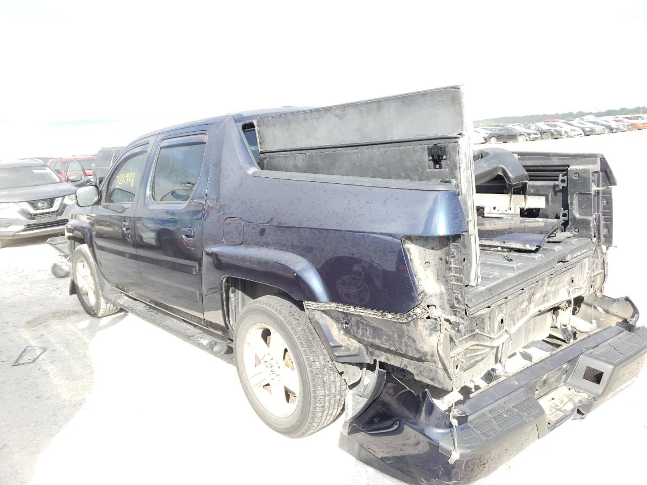 Photo 3 from auction – 2011 HONDA RIDGELINE with VIN 5FPYK1F5XBB008561