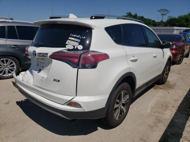 Photo 4 from auction – 2017 TOYOTA RAV4 XLE with VIN JTMWFREV5HJ704833