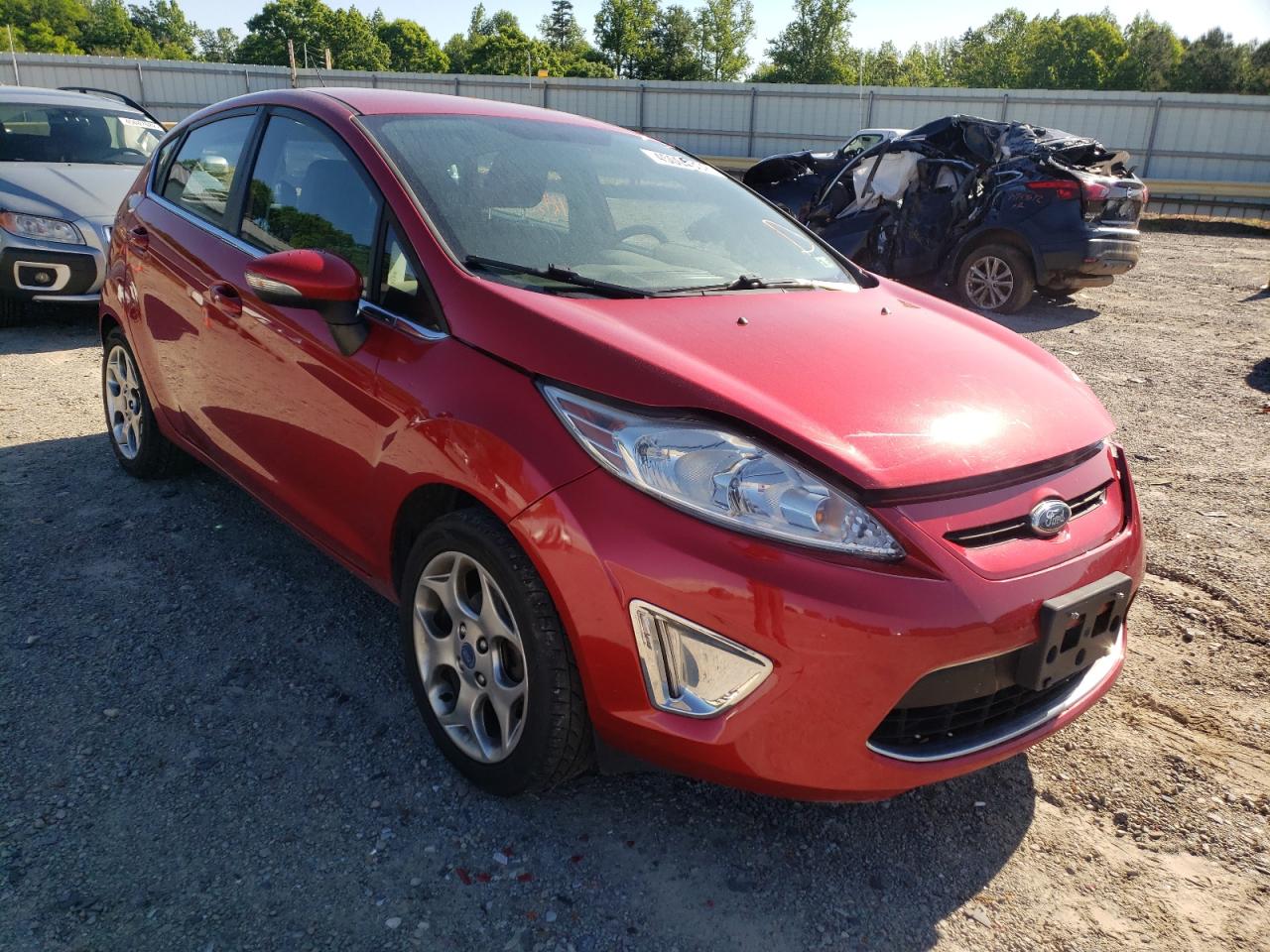 FORD FIESTA SES 2012 with VIN 3FADP4FJ1CM128355 - Photo from auction