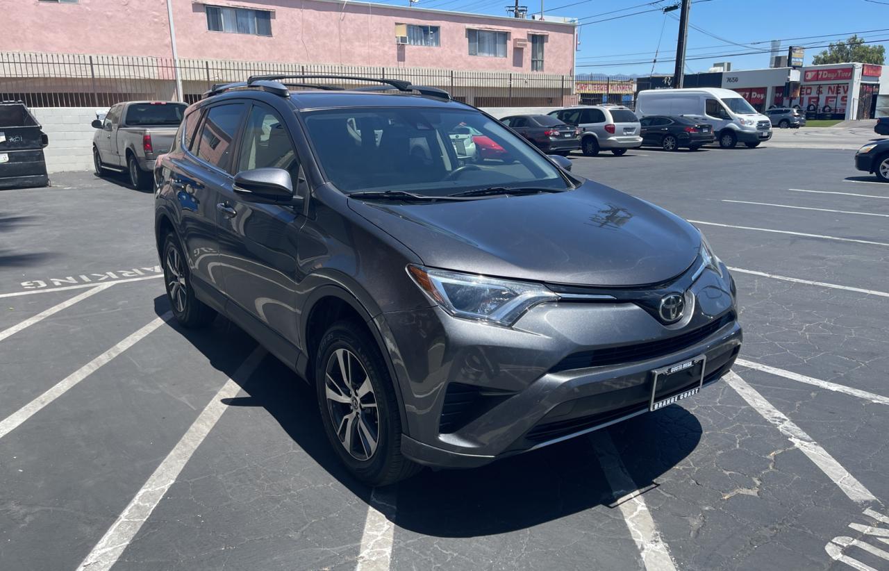 TOYOTA RAV4 XLE 2017 with VIN JTMWFREV6HJ111028 - Photo from auction