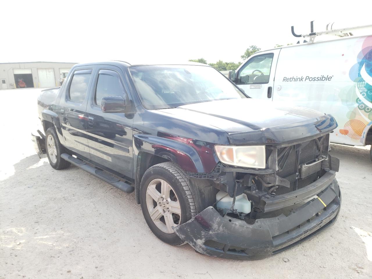 HONDA RIDGELINE 2011 with VIN 5FPYK1F5XBB008561 - Photo from auction