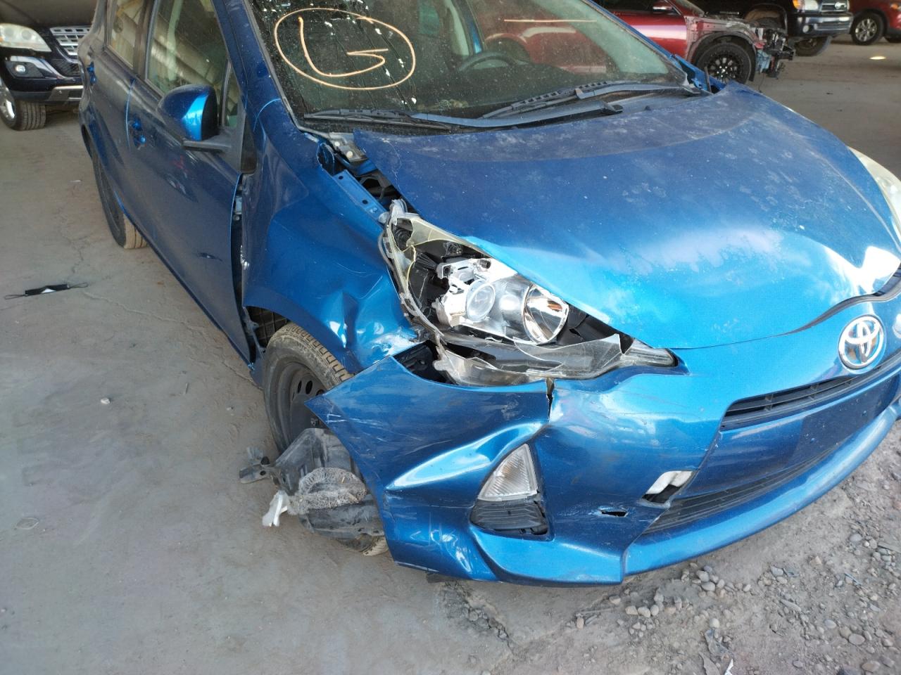 Photo 9 from auction – 2014 TOYOTA PRIUS C with VIN JTDKDTB31E1066709