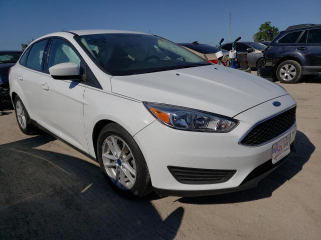 FORD FOCUS SE 2018 with VIN 1FADP3F21JL263952 - Photo from auction