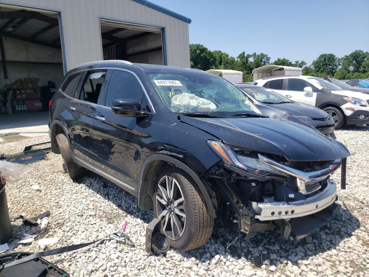 Photo 1 from auction – 2021 HONDA PILOT ELIT with VIN 5FNYF6H04MB025757