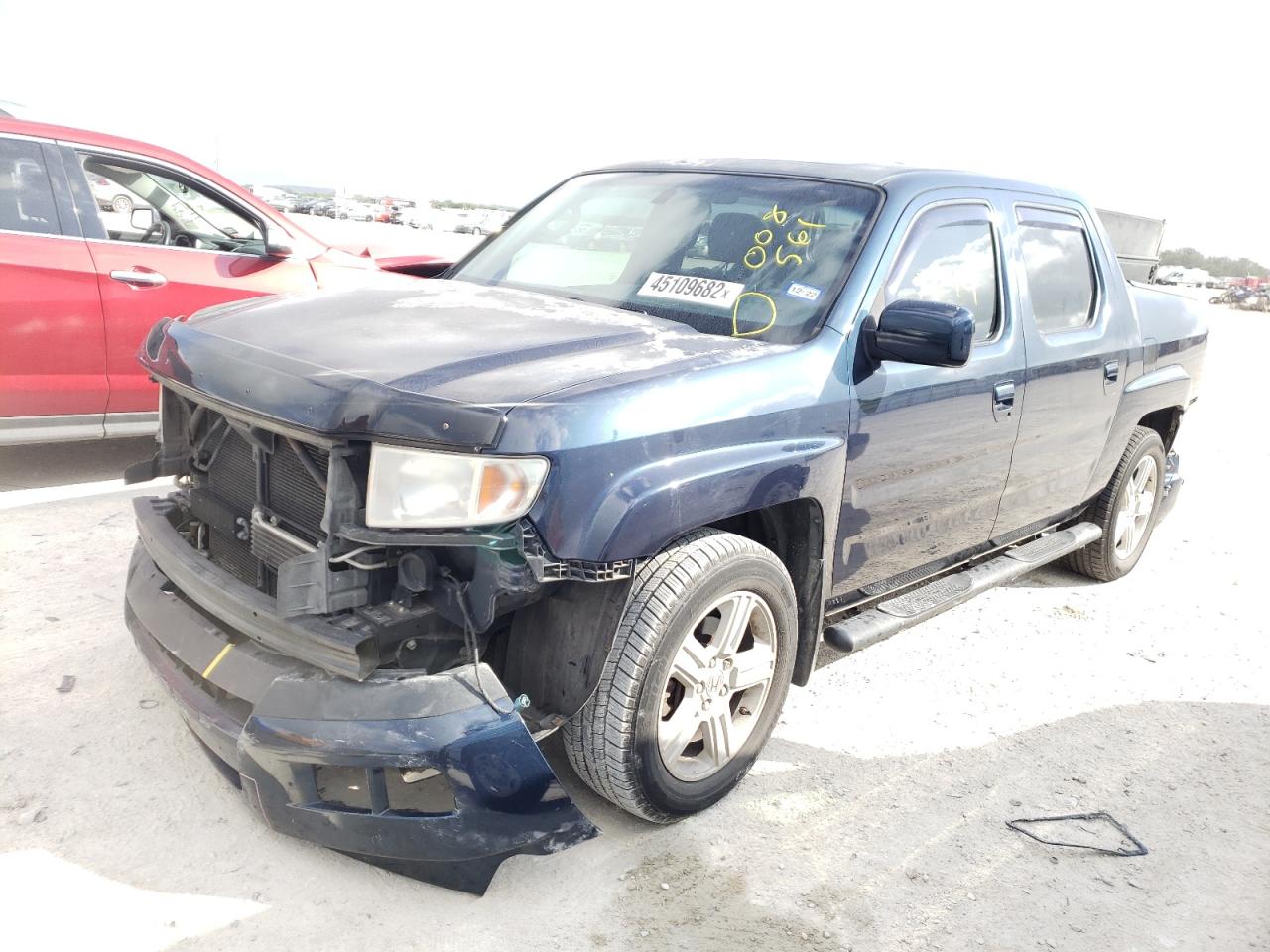 Photo 2 from auction – 2011 HONDA RIDGELINE with VIN 5FPYK1F5XBB008561