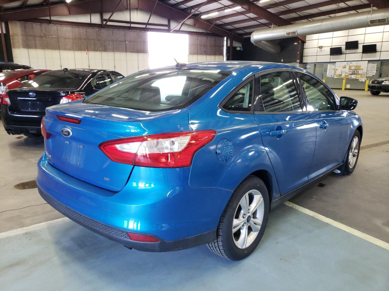 Foto 4 de la subasta – 2013 FORD FOCUS SE con VIN 1FADP3F21DL299645