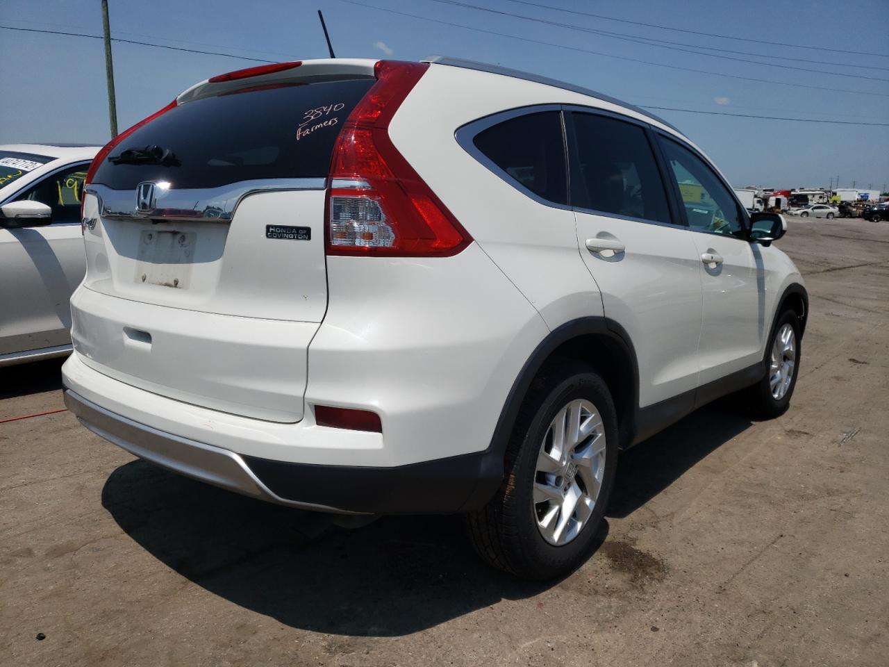 Photo 4 from auction – 2015 HONDA CR-V EXL with VIN 5J6RM3H79FL003236