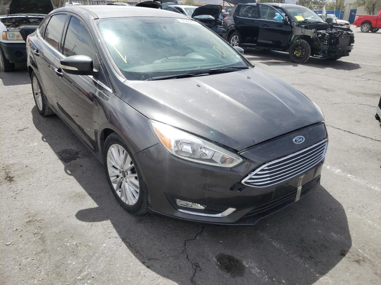 FORD FOCUS TITA 2015 with VIN 1FADP3J20FL358212 - Photo from auction