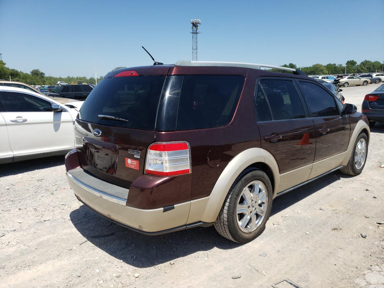 Photo 4 from auction – 2009 FORD TAURUS X E with VIN 1FMDK08WX9GA04030