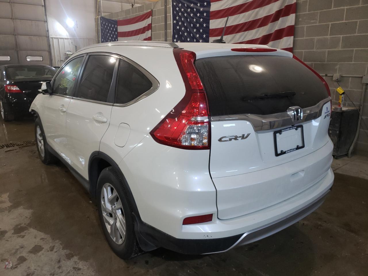 Photo 3 from auction – 2015 HONDA CR-V EXL with VIN 5J6RM4H77FL037973