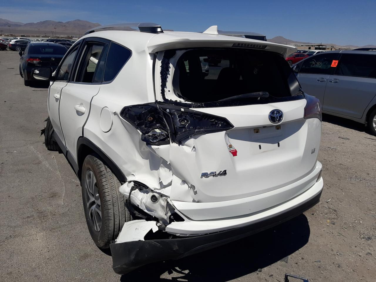 Photo 3 from auction – 2016 TOYOTA RAV4 LE with VIN JTMZFREV8GJ095149