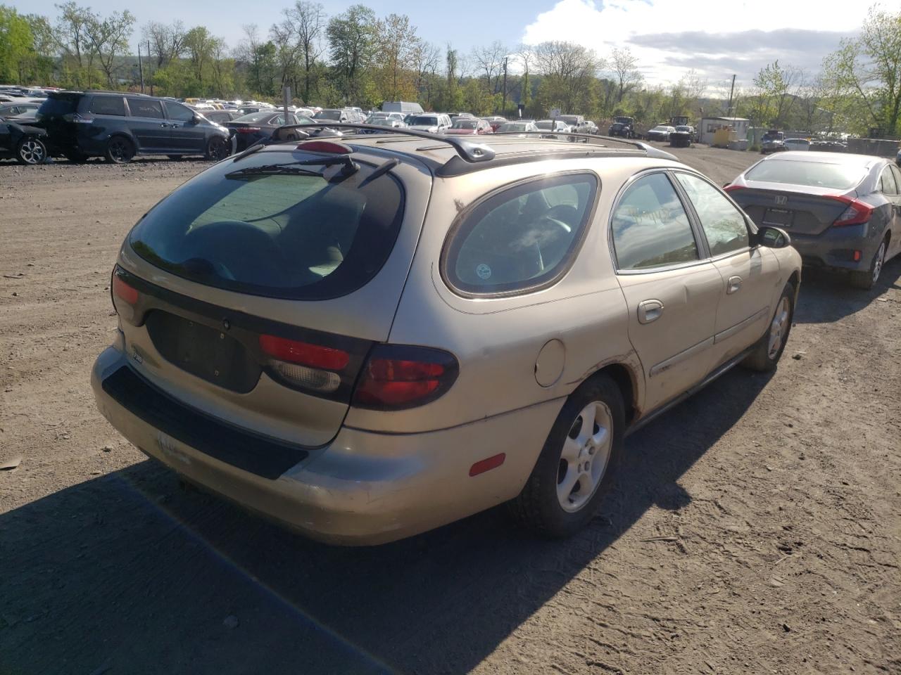 Photo 4 from auction – 2000 FORD TAURUS with VIN 1FAFP5824YG184974