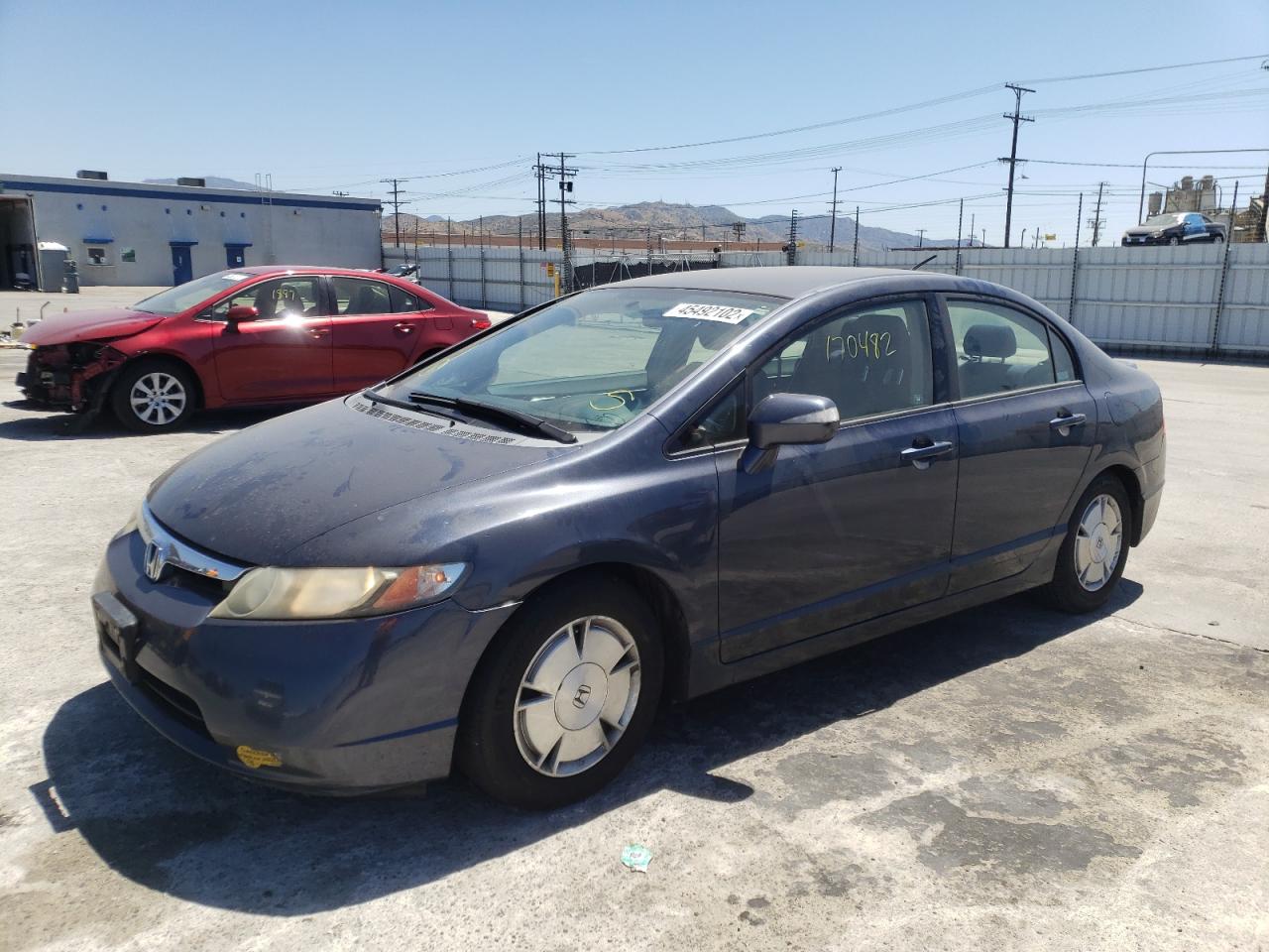 Photo 2 from auction – 2006 HONDA CIVIC HYBR with VIN JHMFA36206S019404
