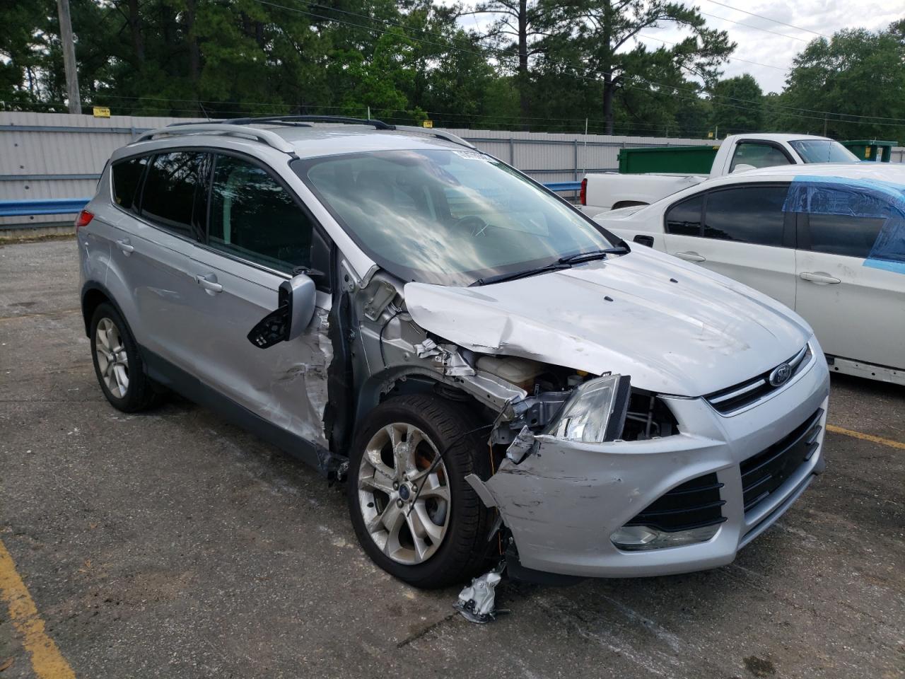 FORD ESCAPE TIT 2016 with VIN 1FMCU0JX1GUA17627 - Photo from auction