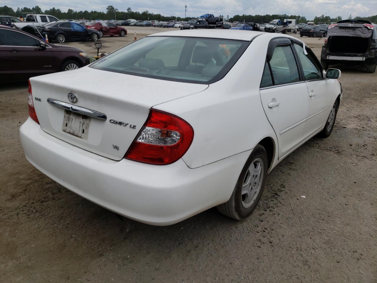 Photo 14 from auction – 2002 TOYOTA CAMRY LE with VIN 4T1BF32KX2U005205