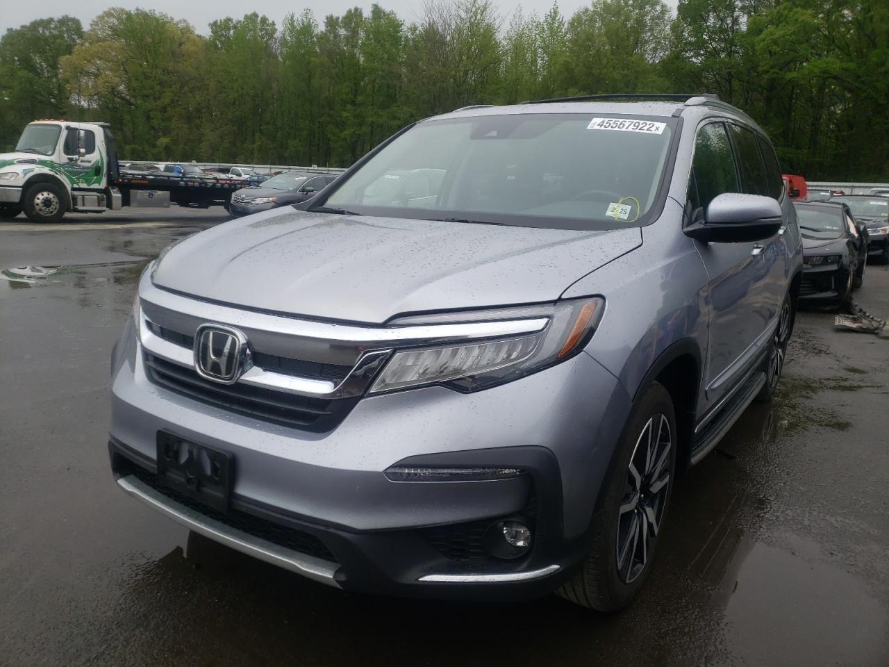 Photo 2 from auction – 2019 HONDA PILOT ELIT with VIN 5FNYF6H06KB024283