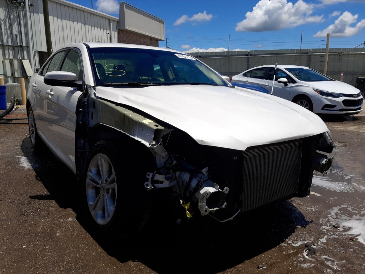 FORD TAURUS SEL 2016 with VIN 1FAHP2E8XGG118458 - Photo from auction
