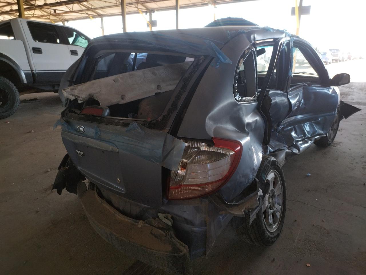 Photo 4 from auction – 2004 KIA RIO CINCO with VIN KNADC165346184660