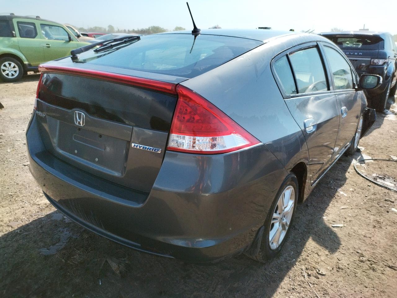 Photo 4 from auction – 2010 HONDA INSIGHT EX with VIN JHMZE2H72AS027601