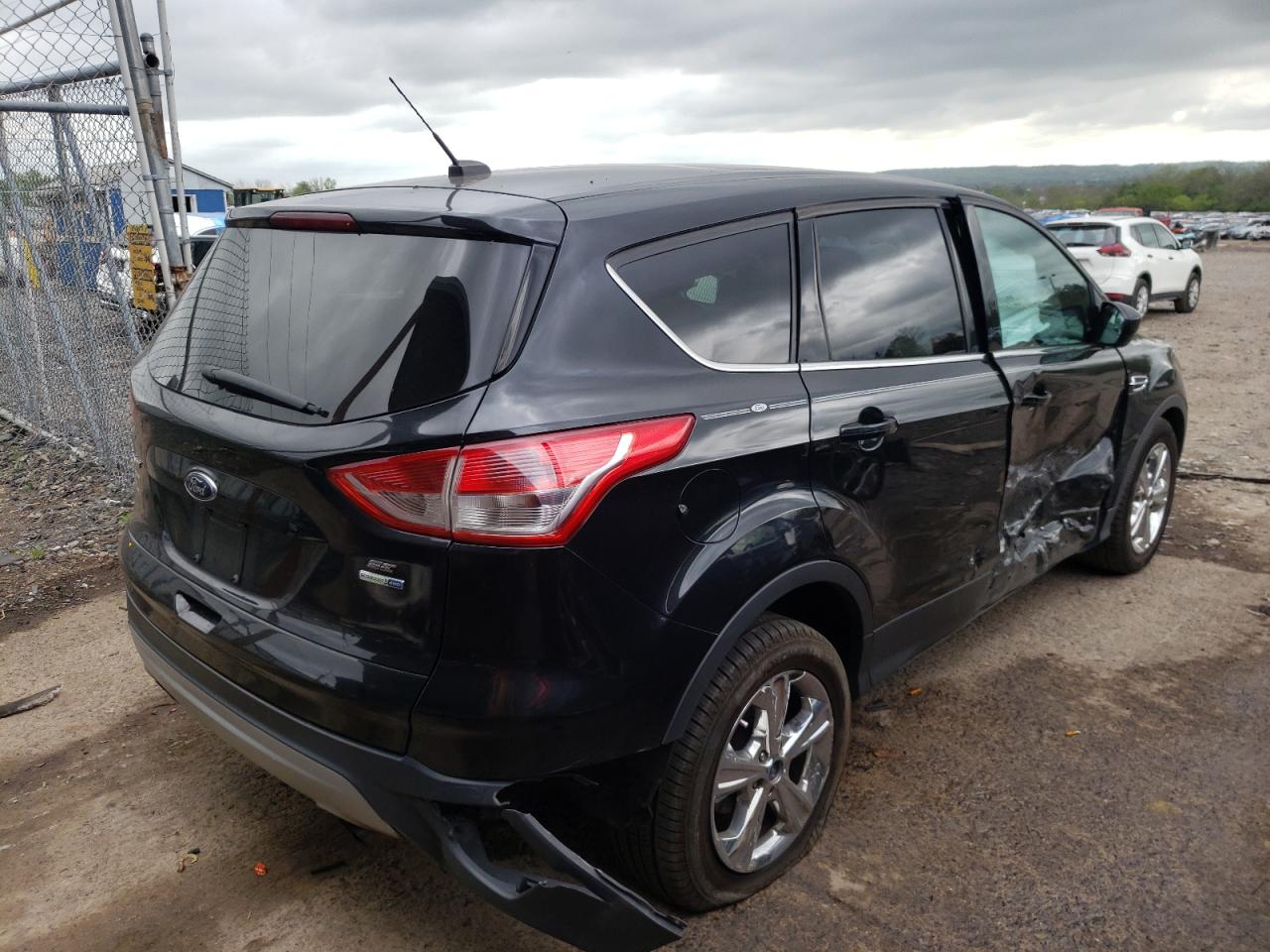 Photo 4 from auction – 2015 FORD ESCAPE SE with VIN 1FMCU9G92FUB32250