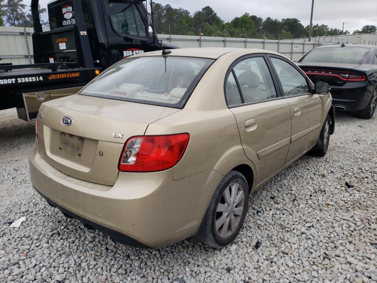 Photo 4 from auction – 2011 KIA RIO BASE with VIN KNADH4A33B6733991