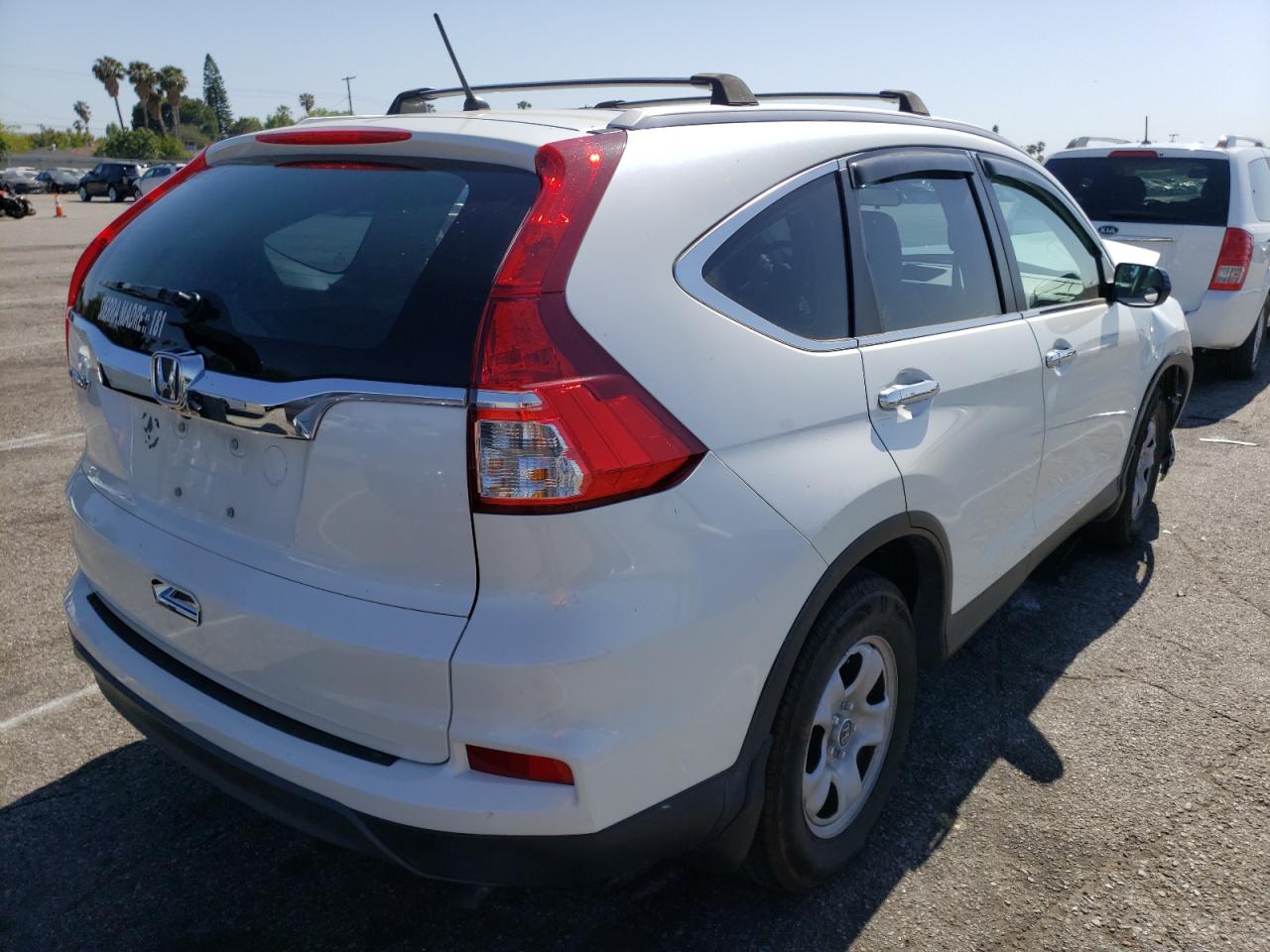 Photo 4 from auction – 2016 HONDA CR-V LX with VIN 5J6RM3H34GL009055