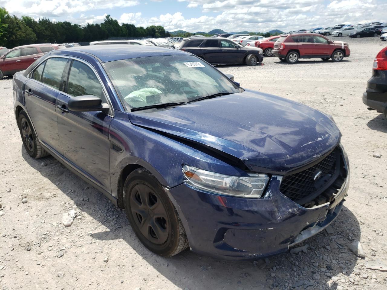 FORD TAURUS POL 2013 with VIN 1FAHP2M81DG121424 - Photo from auction