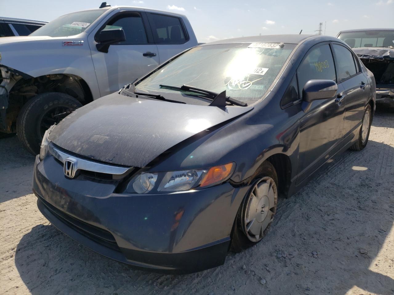 Photo 2 from auction – 2006 HONDA CIVIC HYBR with VIN JHMFA36206S027888