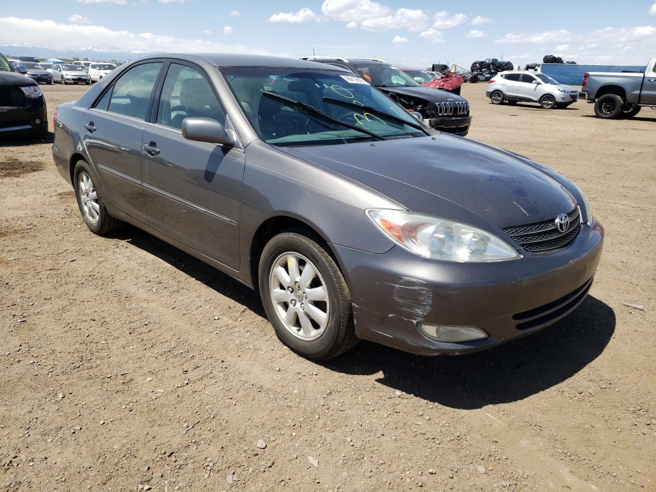 TOYOTA CAMRY LE 2004 with VIN 4T1BE30KX4U829083 - Photo from auction
