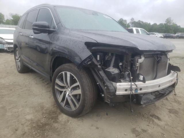 HONDA PILOT TOUR 2017 with VIN 5FNYF5H94HB004342 - Photo from auction