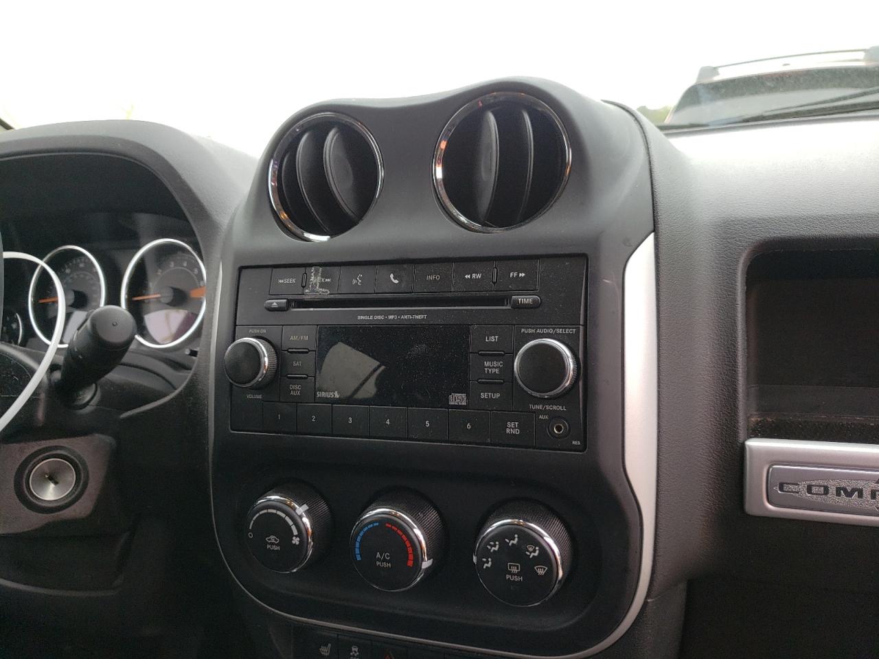 Photo 9 from auction – 2014 JEEP COMPASS LA with VIN 1C4NJDEB1ED858789
