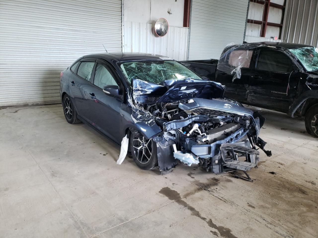 FORD FOCUS SEL 2018 with VIN 1FADP3H24JL306810 - Photo from auction