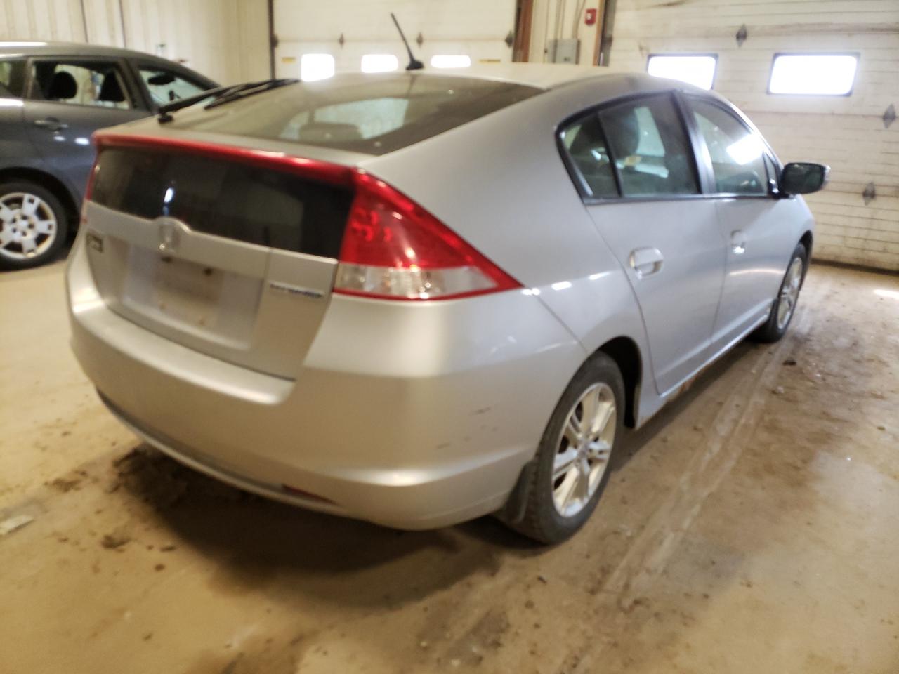 Photo 4 from auction – 2010 HONDA INSIGHT EX with VIN JHMZE2H72AS035763
