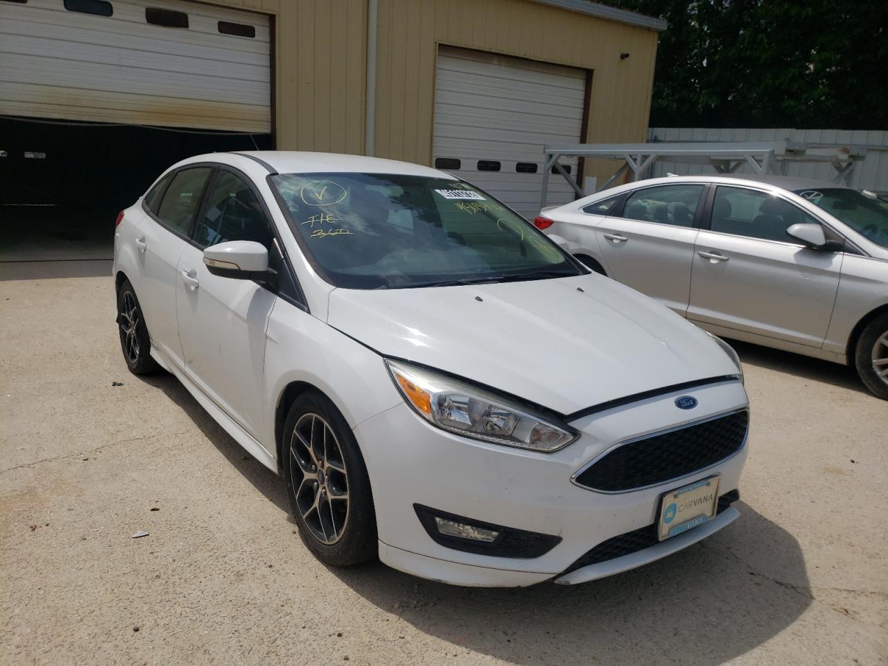 FORD FOCUS SE 2015 with VIN 1FADP3F2XFL354077 - Photo from auction