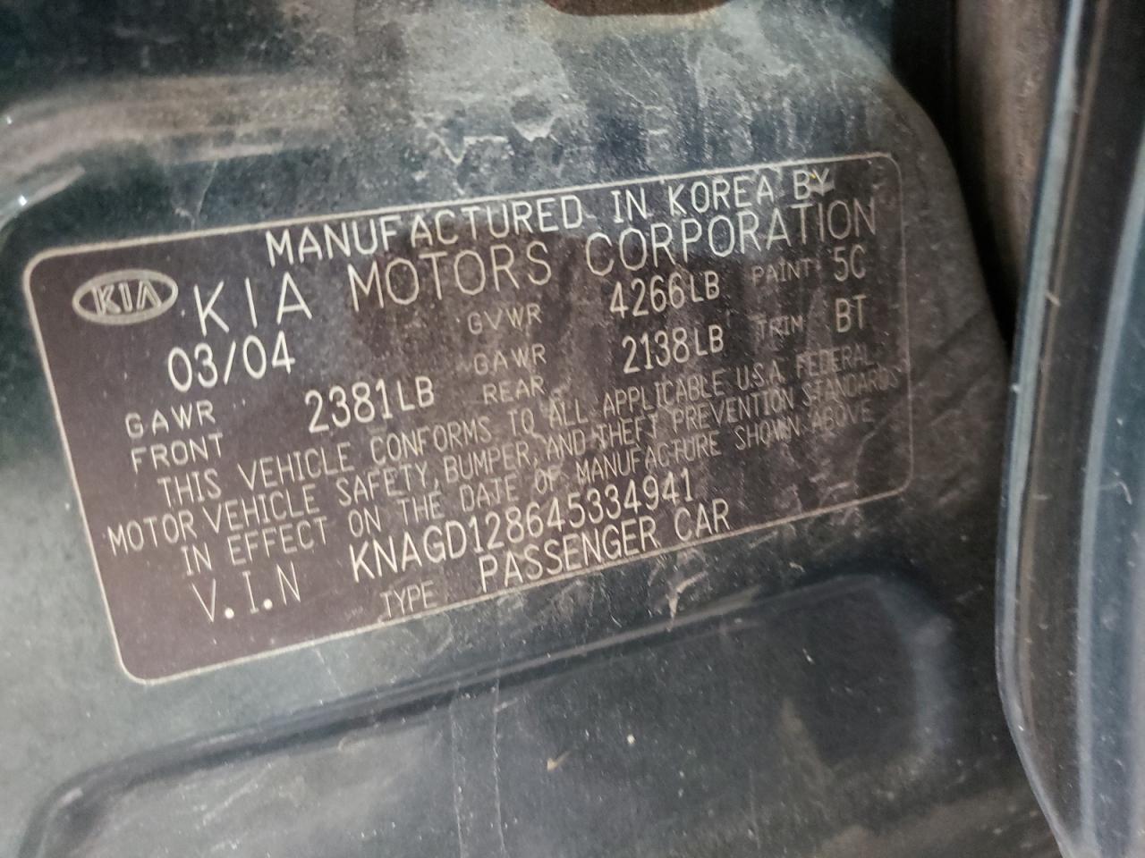 Photo 10 from auction – 2004 KIA OPTIMA LX with VIN KNAGD128645334941