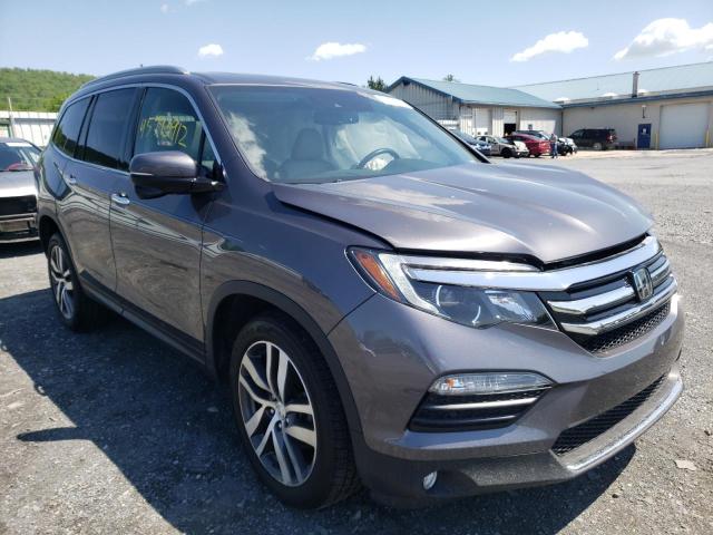 HONDA PILOT TOUR 2017 with VIN 5FNYF6H90HB071249 - Photo from auction